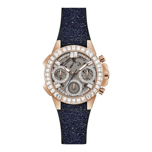 Elegant ladies Guess Bombshell GW0313L3 watch with diamond-studded bezel and sparkling navy blue strap, showcased on a plain background.