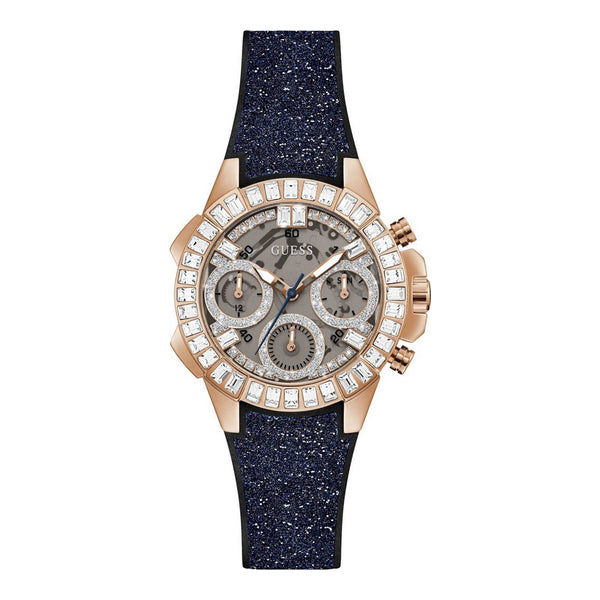 Elegant ladies Guess Bombshell GW0313L3 watch with diamond-studded bezel and sparkling navy blue strap, showcased on a plain background.