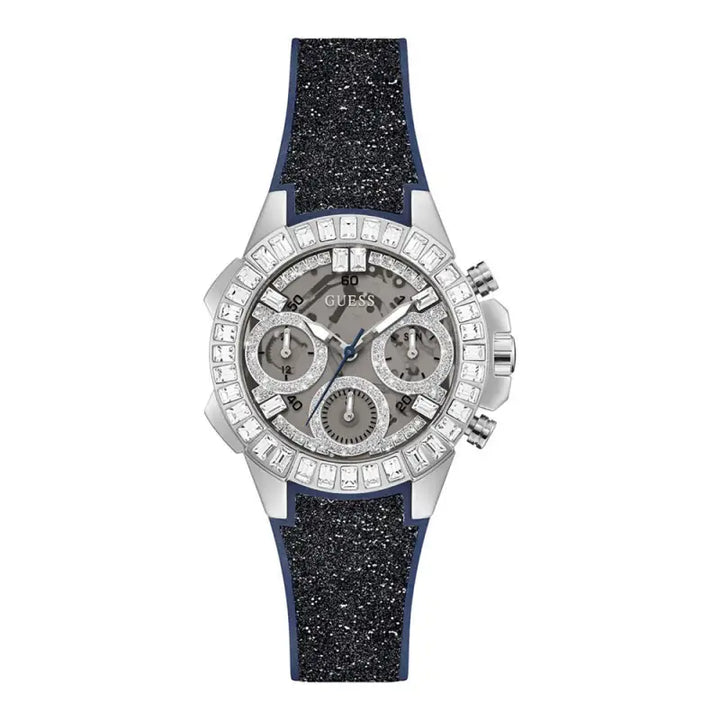 Elegant Guess Bombshell GW0313L1 ladies watch with a silver-toned case, bejeweled bezel, and a sparkling navy blue silicone strap.