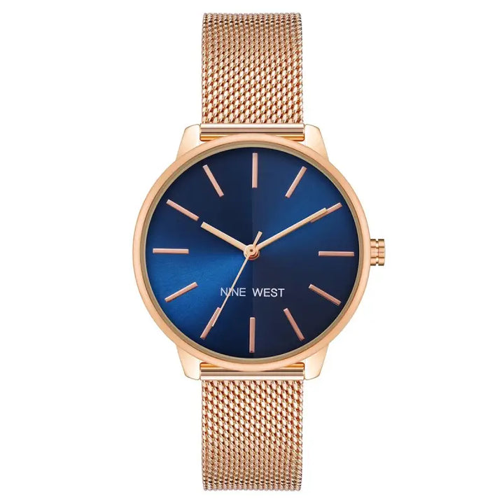 Elegant rose gold-toned ladies' watch by Nine West, featuring a navy blue dial and a sleek mesh bracelet strap, for a stylish and sophisticated look.