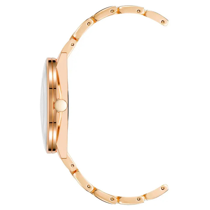 Elegant rose gold-toned ladies' watch with a sleek, modern design and accented with small metal studs along the bezel.