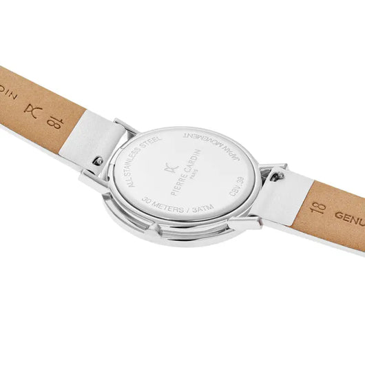 A silver-toned ladies' watch by Pierre Cardin, with a round analog dial and a tan leather strap. The watch is placed on a plain white background, showcasing its simple yet elegant design.