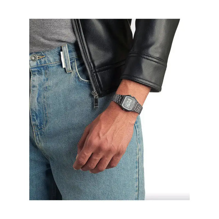 Compact Vintage-Style Timepiece: A classic men's watch with a 33mm stainless steel case, displayed on the wrist against a backdrop of denim jeans and a black leather jacket, creating a stylish, casual look.