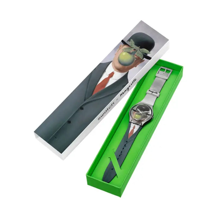 Classic stainless steel men's watch in sleek metal casing, placed on vibrant green presentation box with product branding.