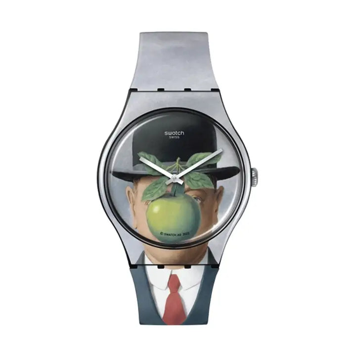 Men's stylish wristwatch with unique apple motif design. Features a transparent case displaying an apple-themed face with a suited figure holding an apple.